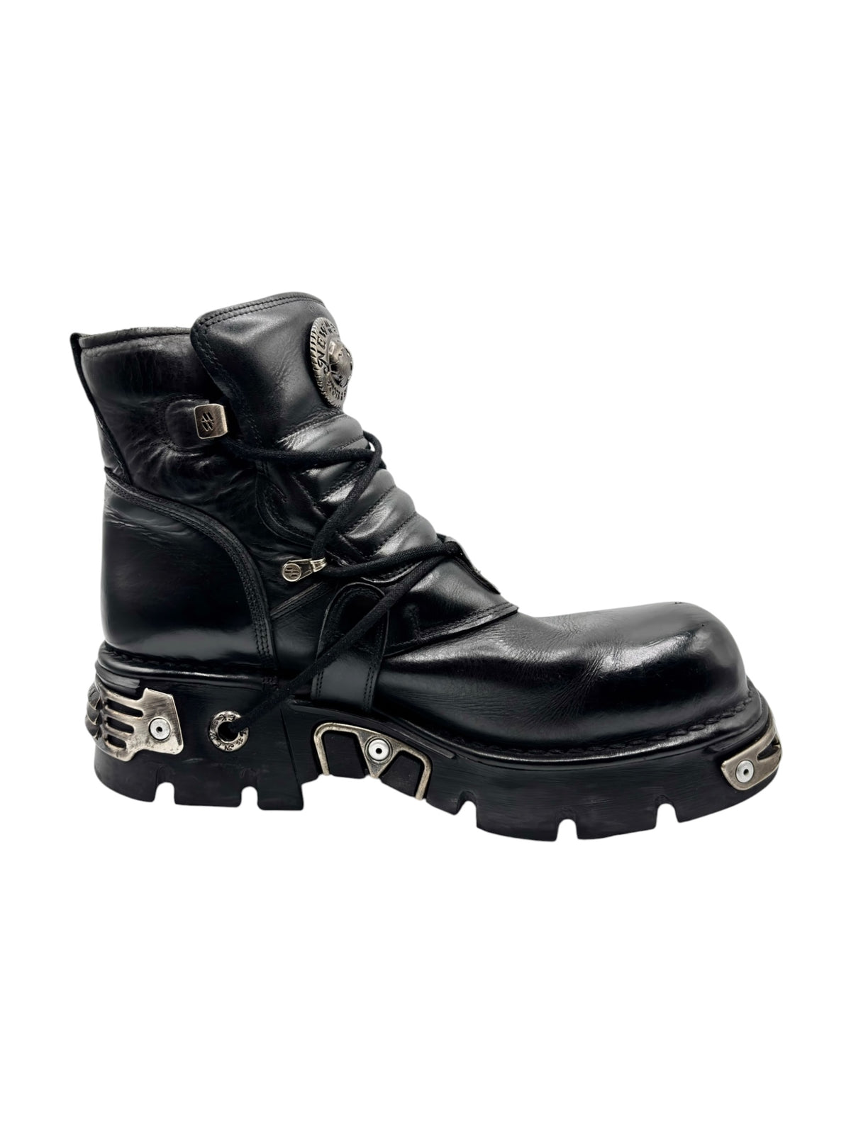 Black lace-up ankle boots with dual straps, buckle details, and thick tread sole