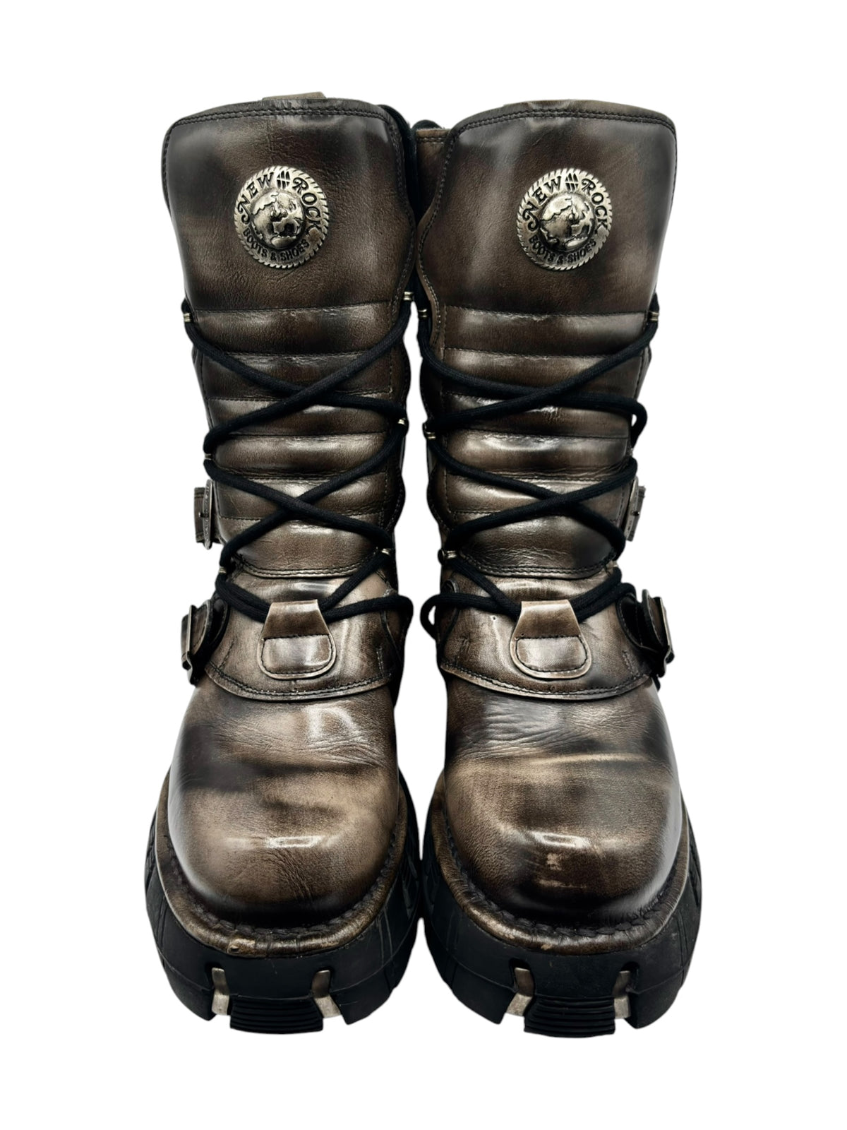 Vintage lace-up leather boots with circular logo, buckles, and chunky black sole