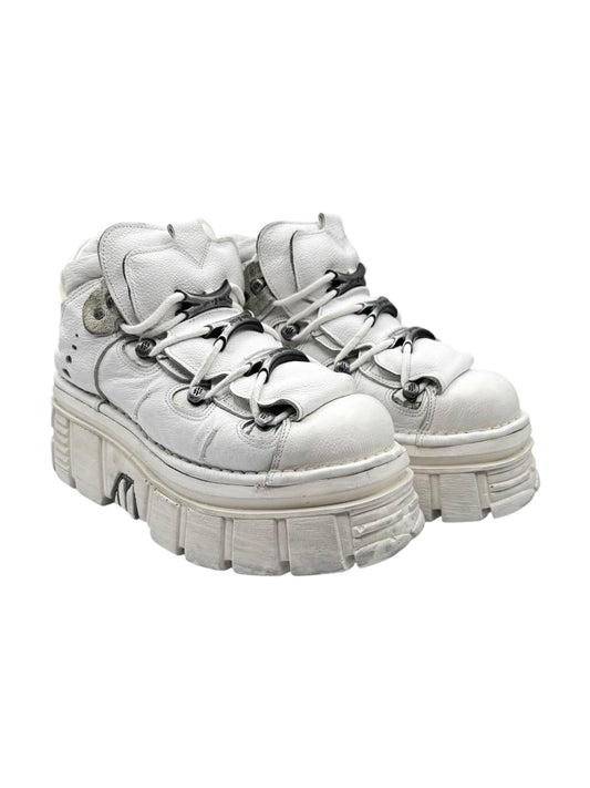 White platform lace-up boots with chunky stacked sole and metal eyelets