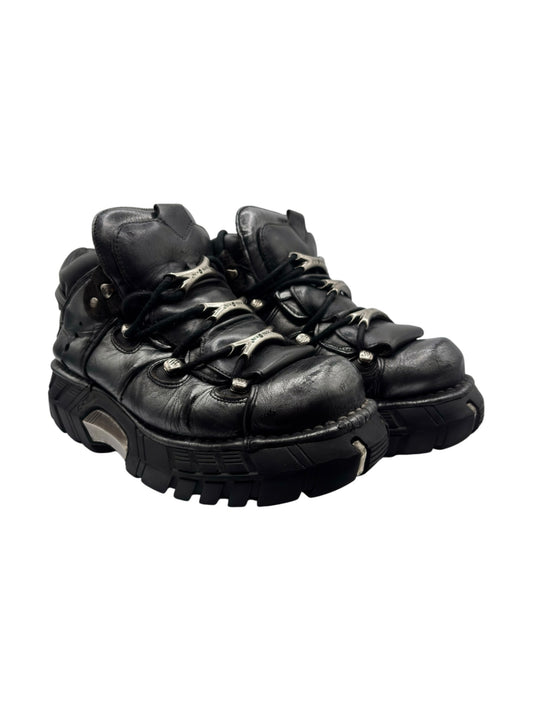 Vintage platform boots in dark leather, lace-up with chunky tread sole and metal eyelets