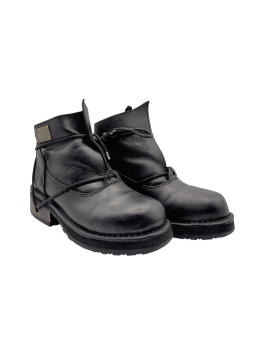 Pair of black leather lace-up ankle boots with chunky tread sole
