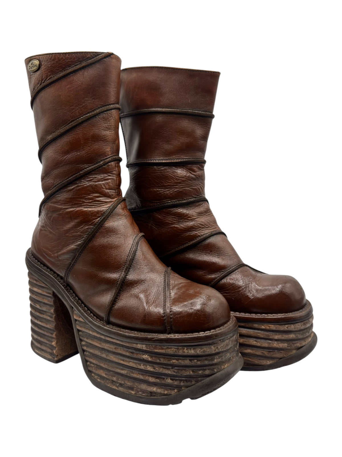 Brown mid-calf leather platform boots with thick stacked heel and curved strap seams