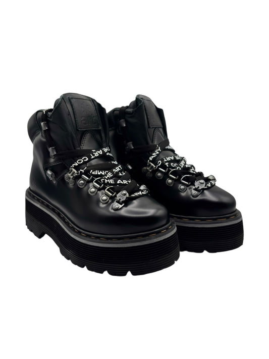 Black leather platform ankle boots with studded lace panel and chunky lug sole