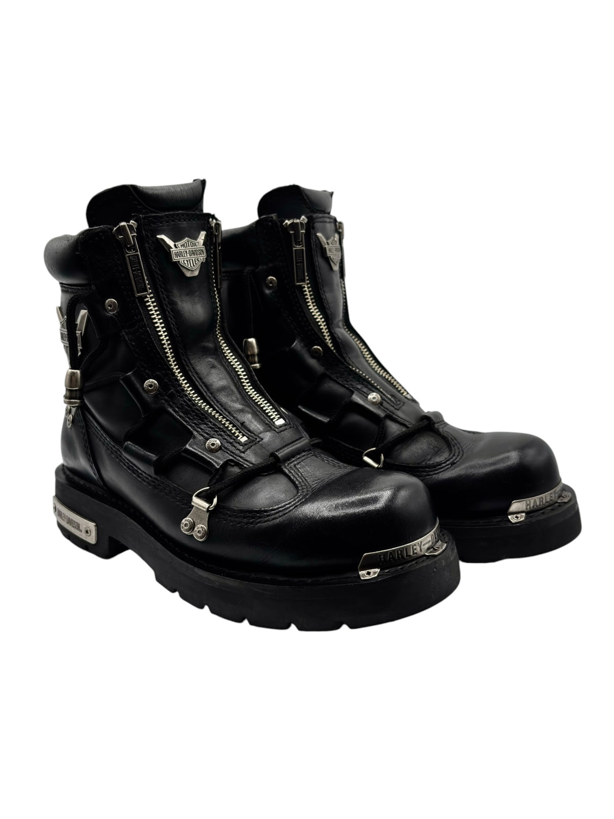 Black leather biker boots with double zippers, buckles, and studded side accents