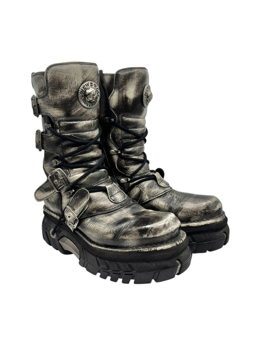 Vintage platform boots three-quarter view, dark khaki leather with layered straps and laces
