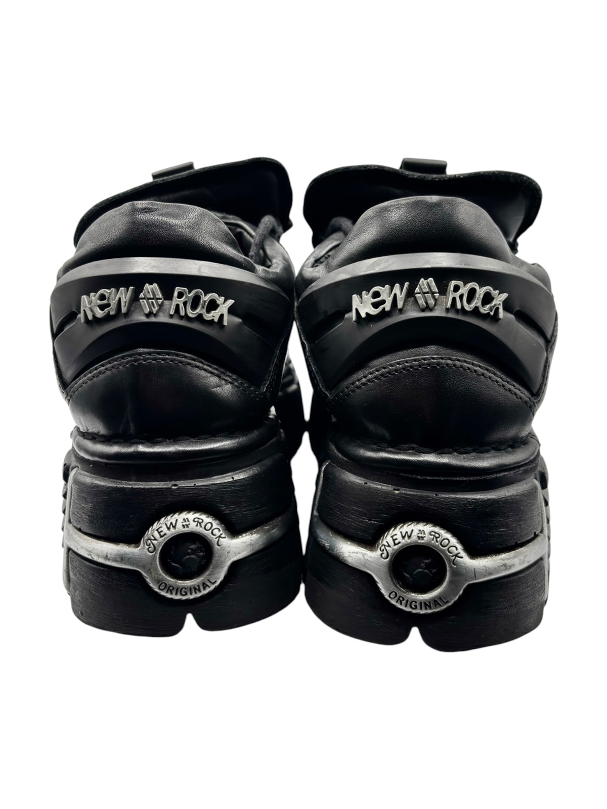 Black platform boots rear view showing “New Rock” text on heel tabs