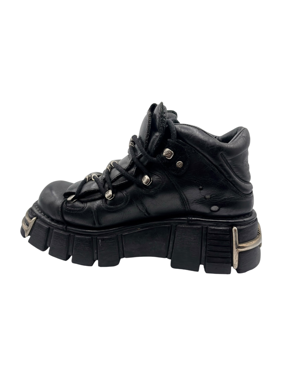 Black lace-up platform boot with round studs and thick molded tread sole
