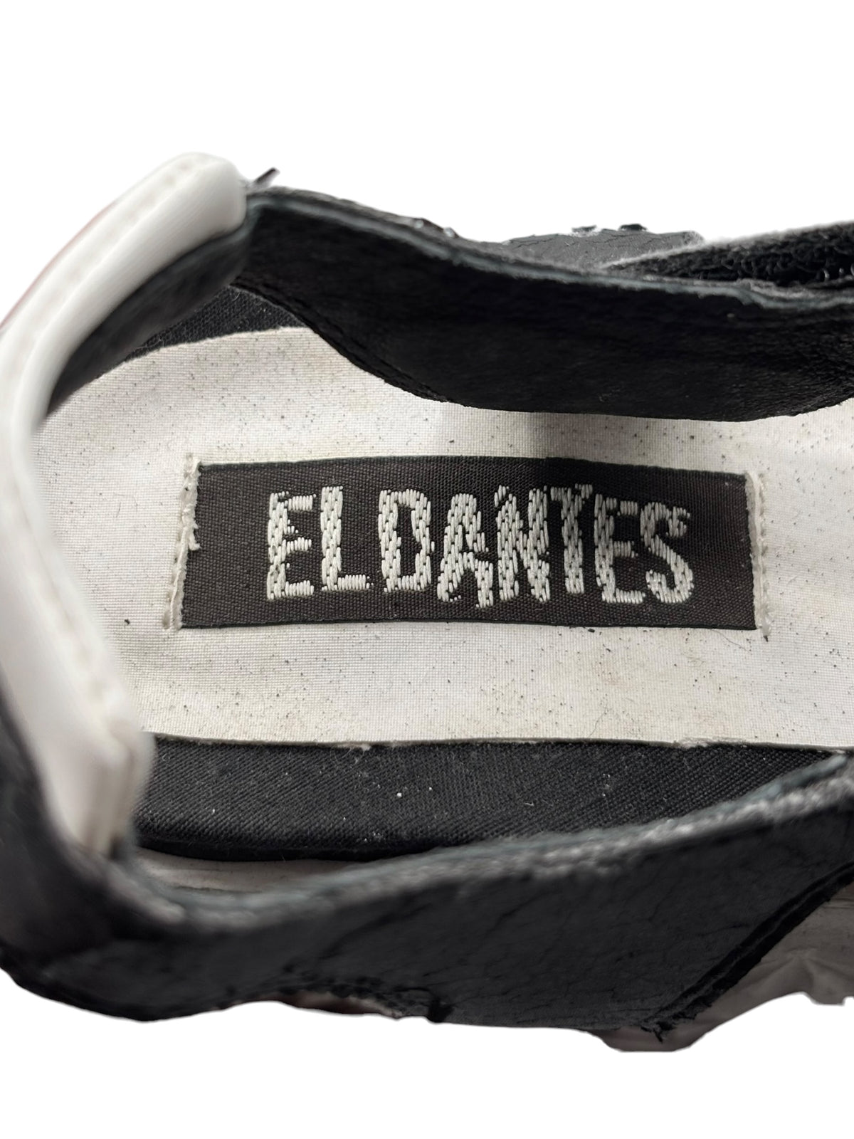 Black platform sandal inner label with EL DANNIES branding