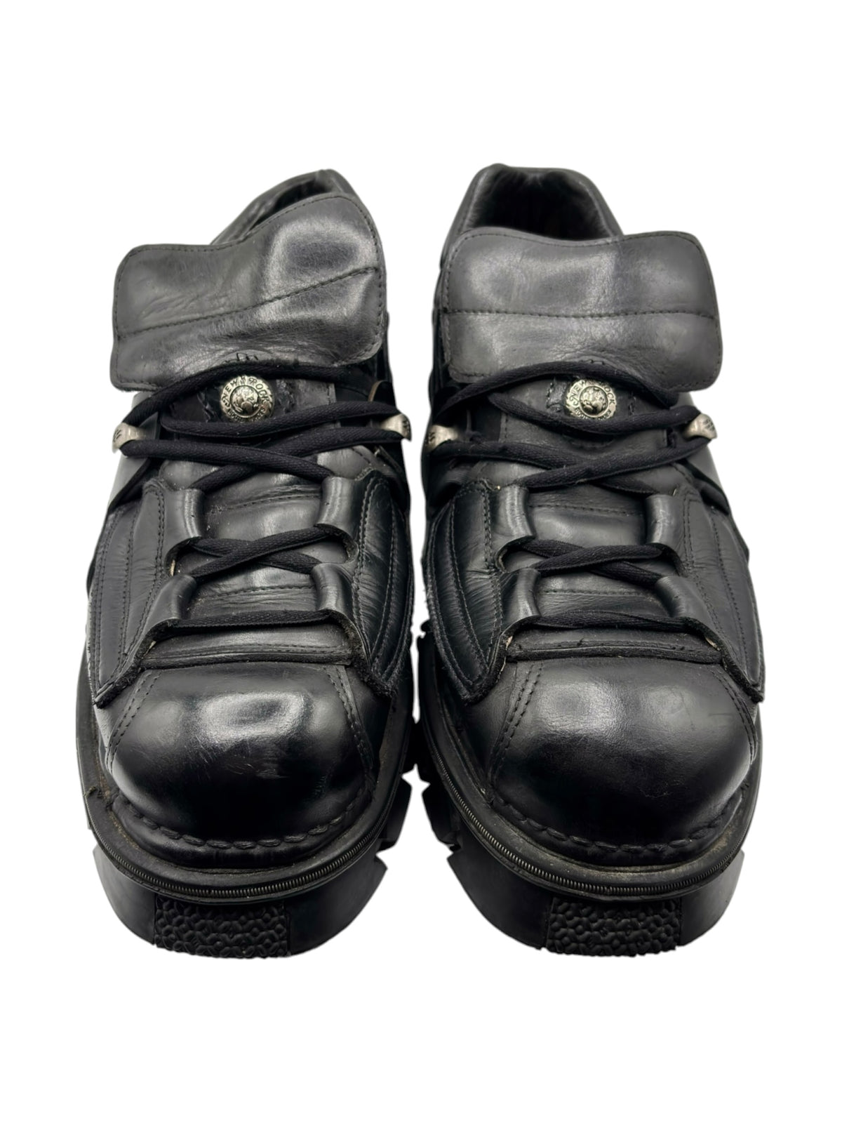 Black leather platform lace-up boots with wide strap and metal buckle detail