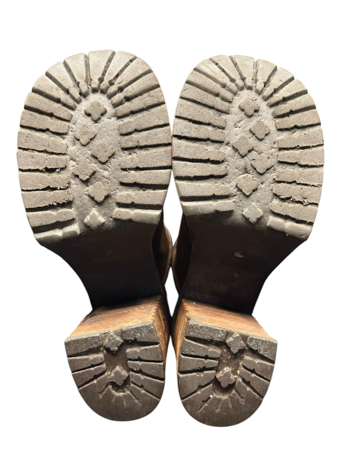 Pair of boot outsoles showing textured tread and chunky platform base