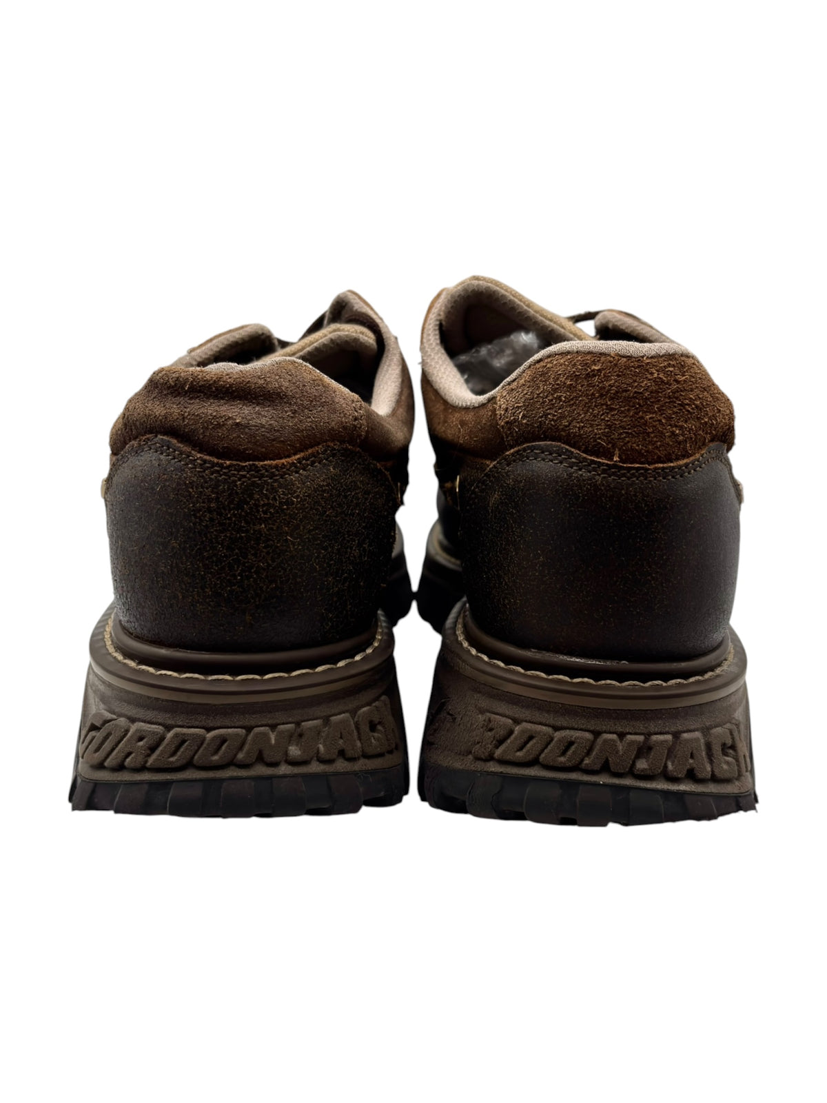 Back view of brown suede platform boots with GORDONJACK logo heel detail