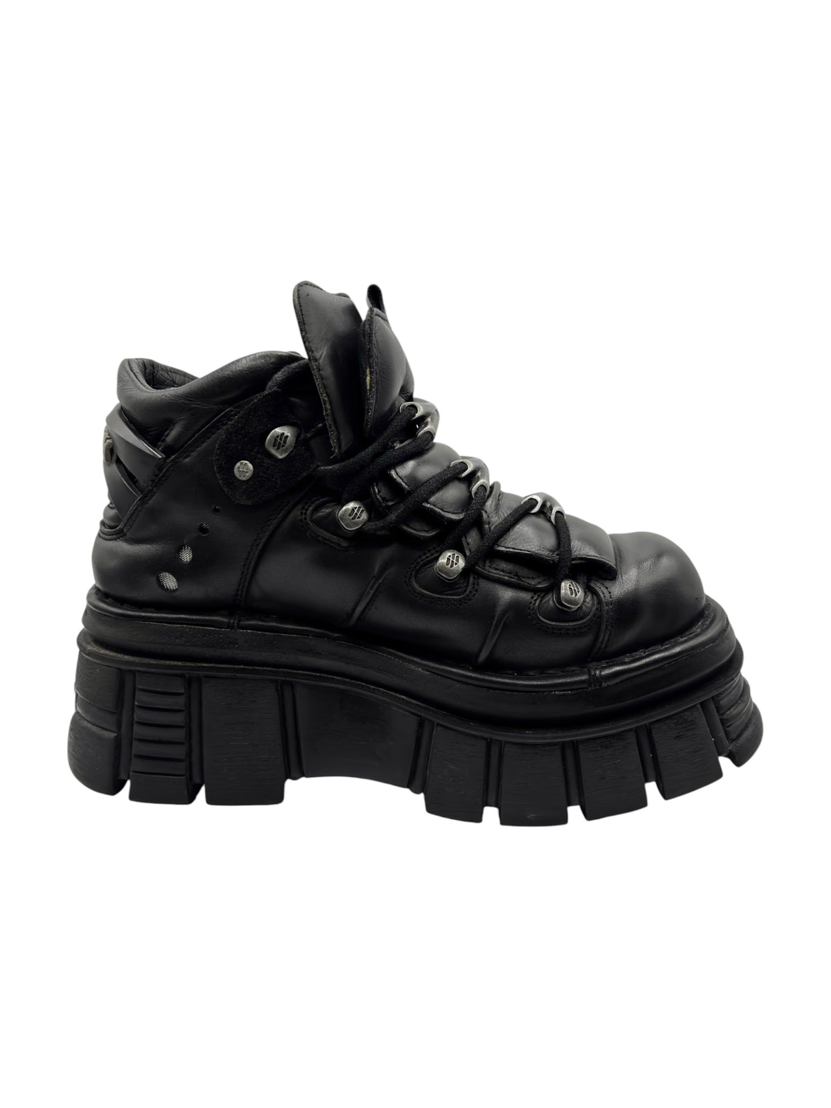 Black lace-up platform boots with chunky heel sole and top lace loops