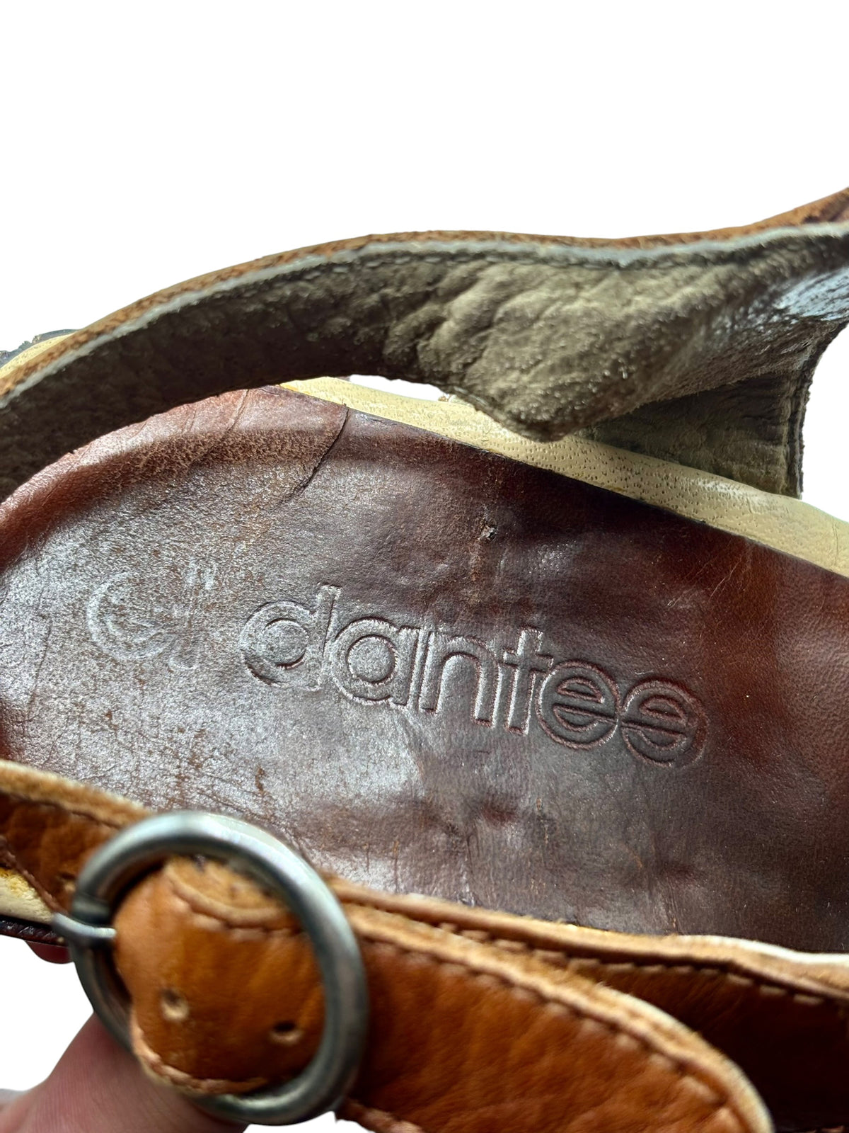 Brown leather sandal insole with El Dantes logo stamp and stitching