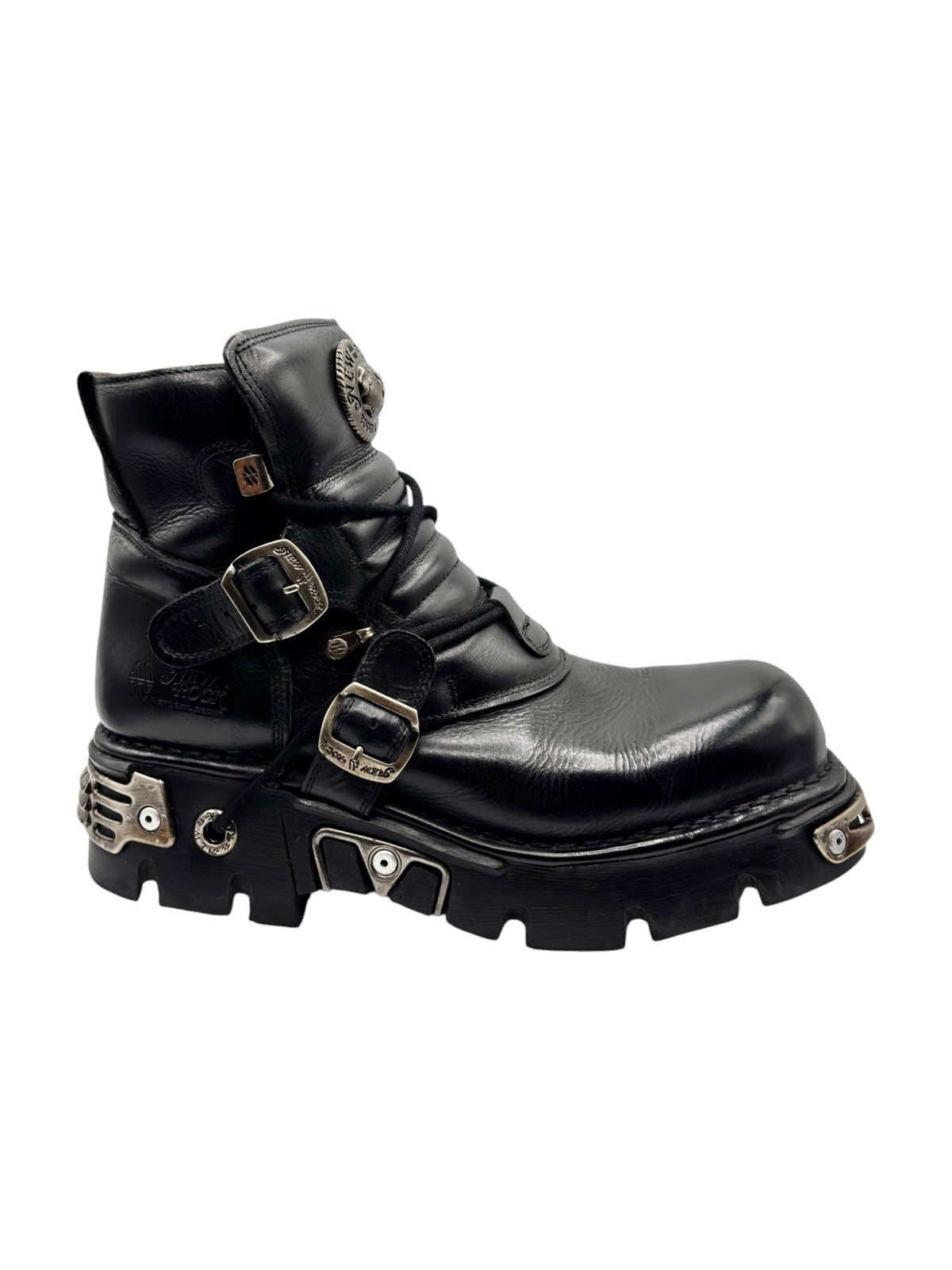 Black leather ankle boots with multiple buckles, straps, and rugged traction sole