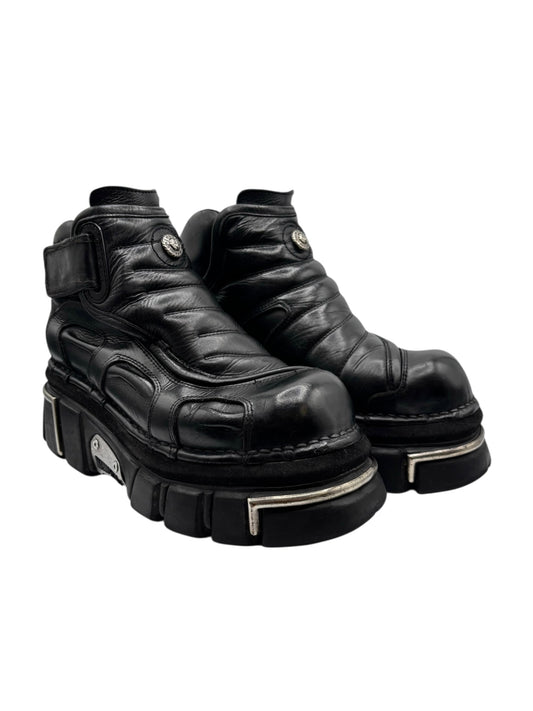 Black leather platform ankle boots with strap detail and chunky tread, silver-tone trim
