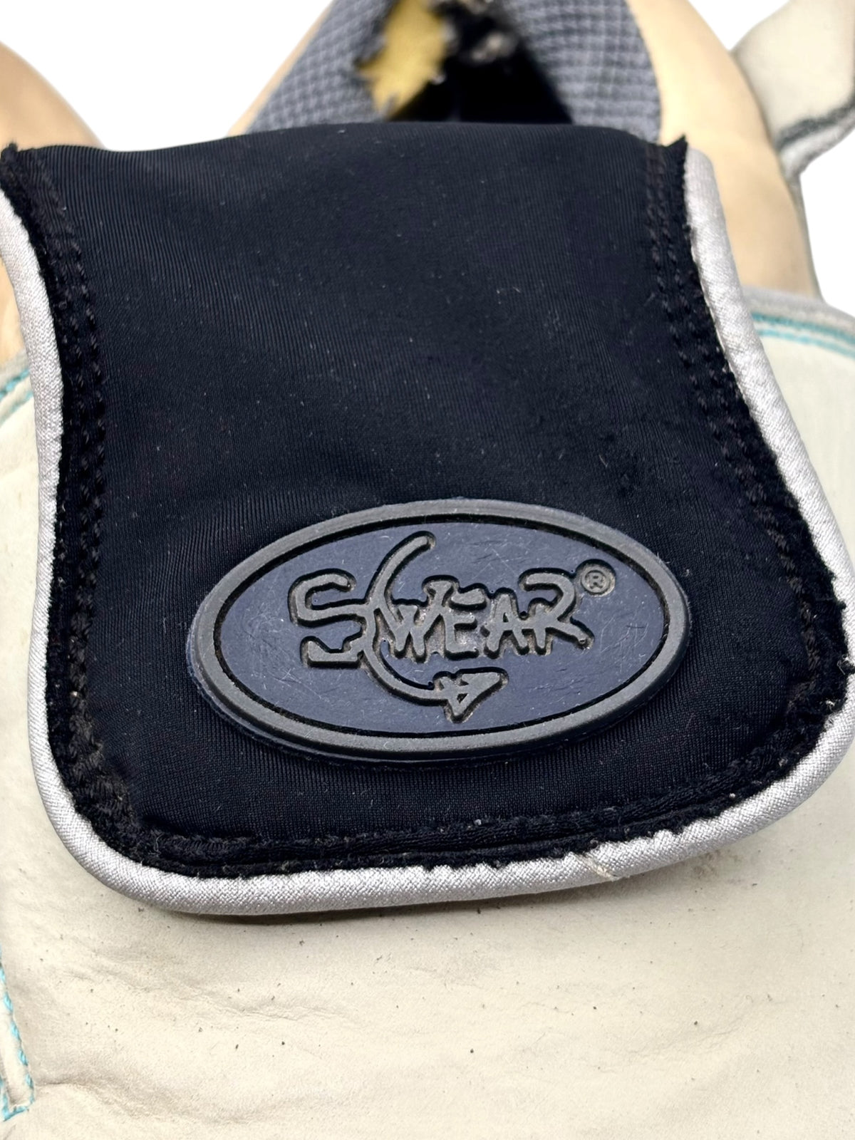 Swear platform boot side logo patch on navy panel near ankle collar
