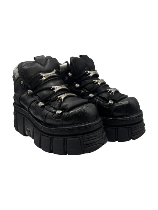 Black lace-up platform ankle boots, side view with chunky stacked sole