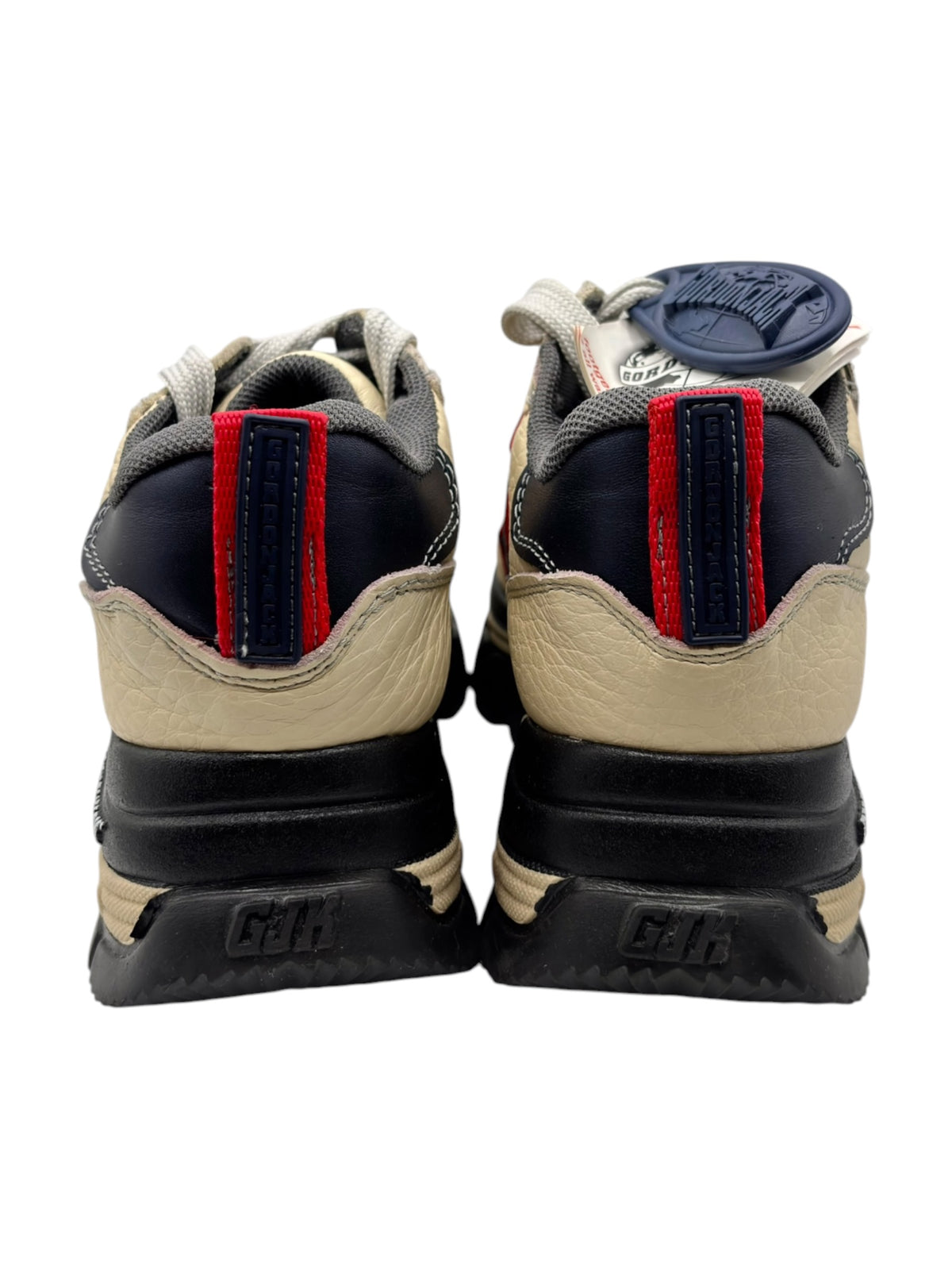 Beige vintage platform sneakers, lace-up with chunky black sole and red/blue heel panels