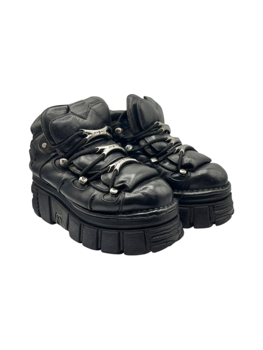 Vintage black leather platform boots, top view pair with chunky tread soles