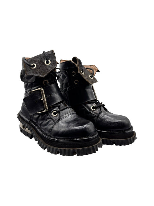 Black leather raised-heel buckle boots with lace-up and side strap, rugged tread sole