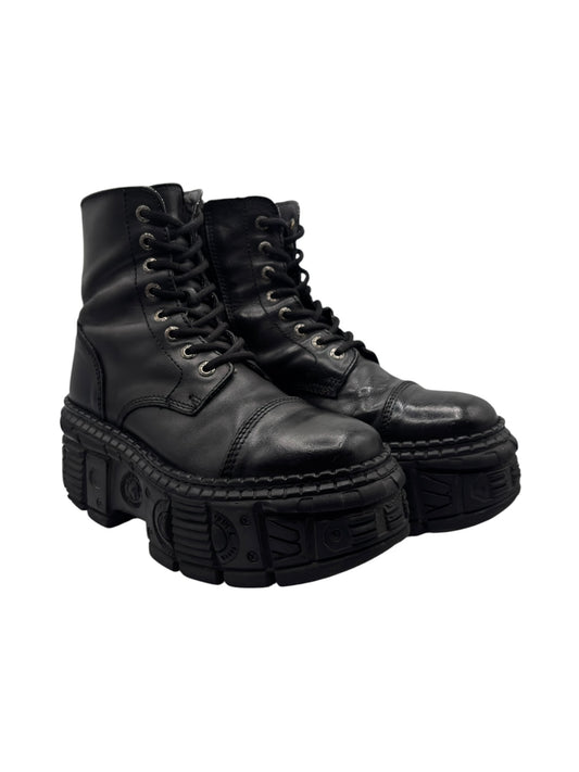 Black leather lace-up platform boots three-quarter view with chunky outsole