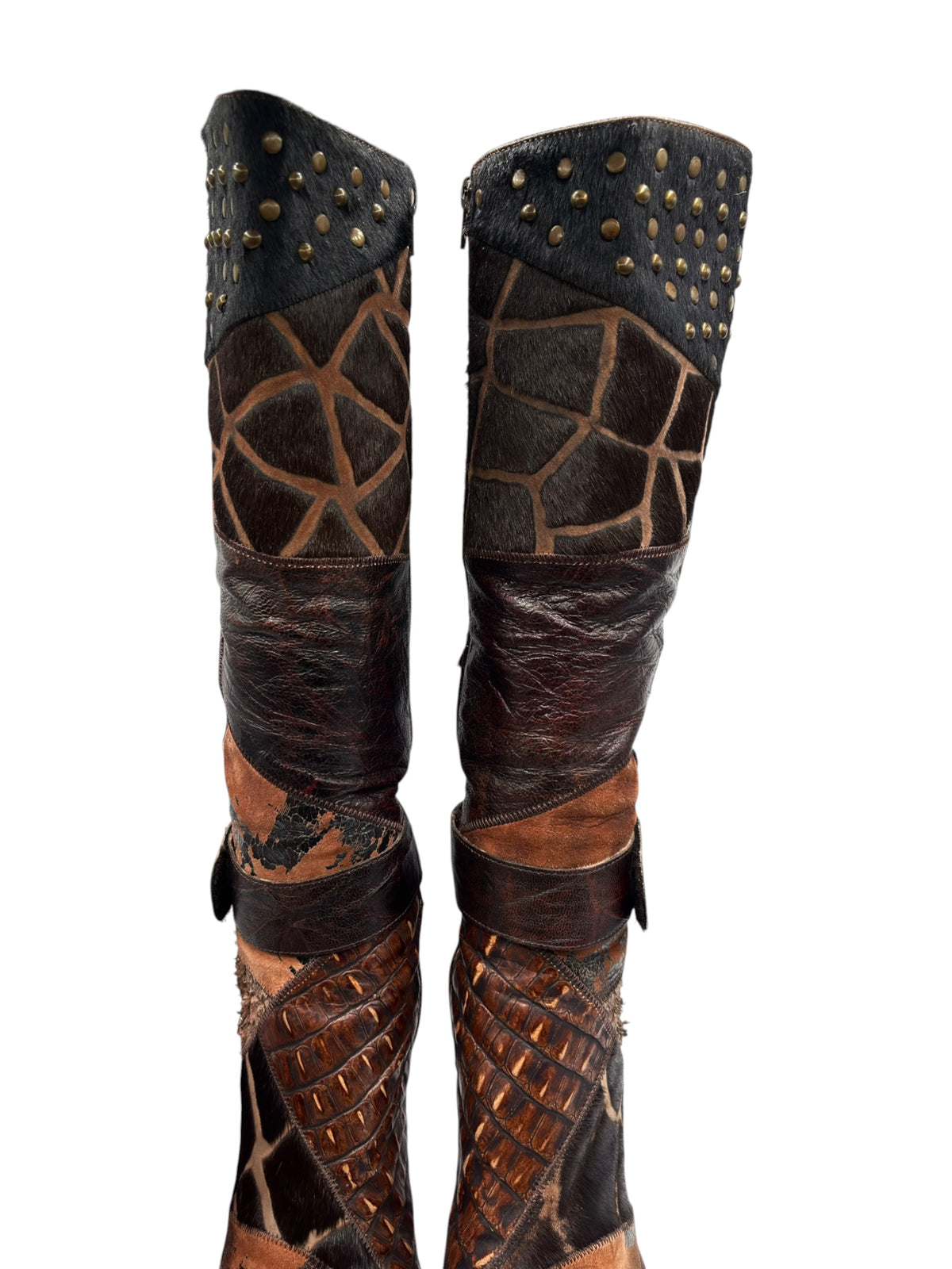 Knee-high patchwork boots, side view, dark brown with geometric panels and gold stud detailing