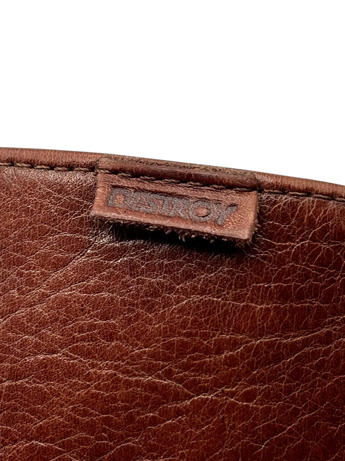 Brown boot leather with DESIRO logo patch on inner panel.