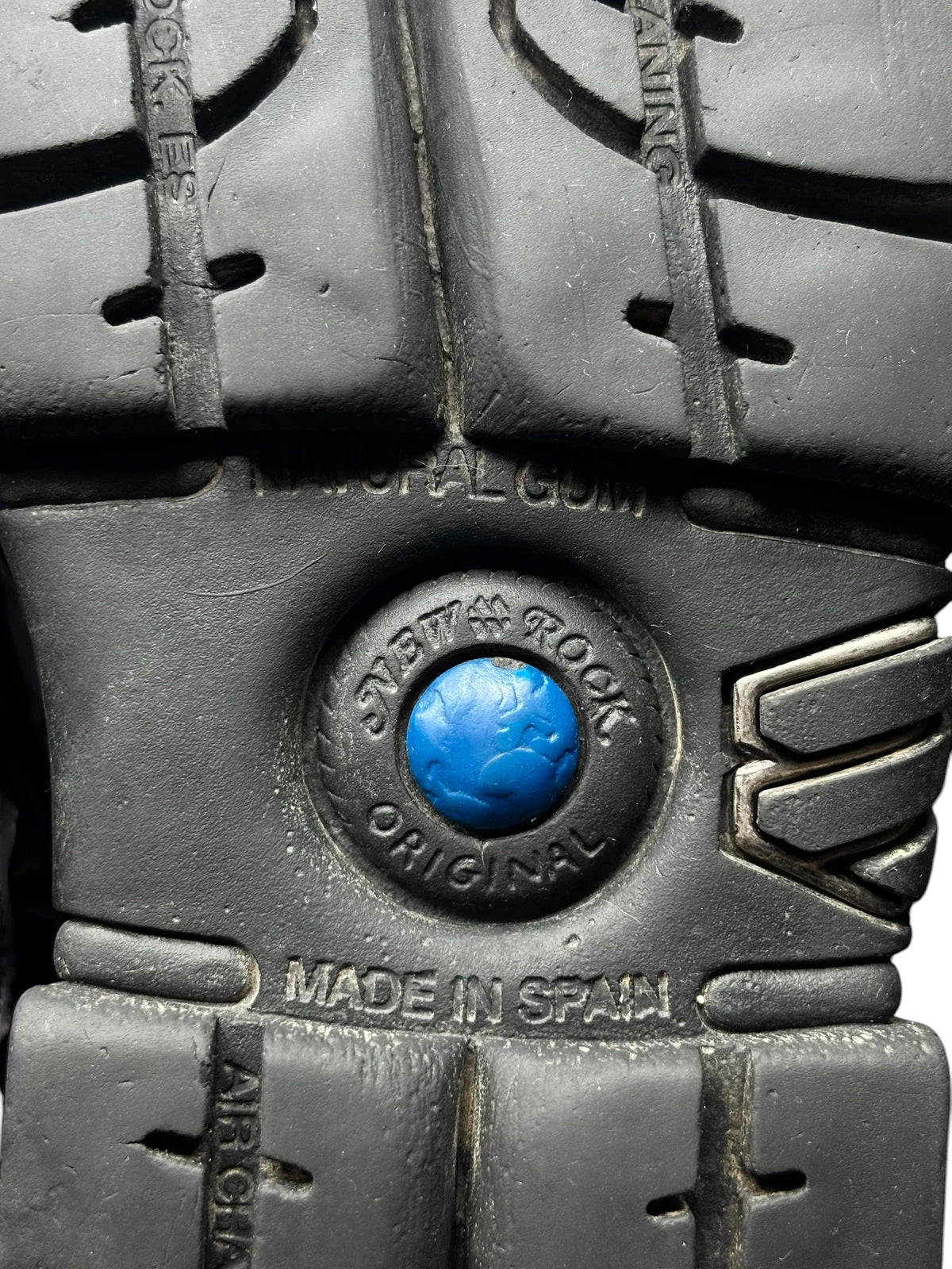 Platform boot outsole detail with blue emblem and stamped text reading "MADE IN SPAIN"