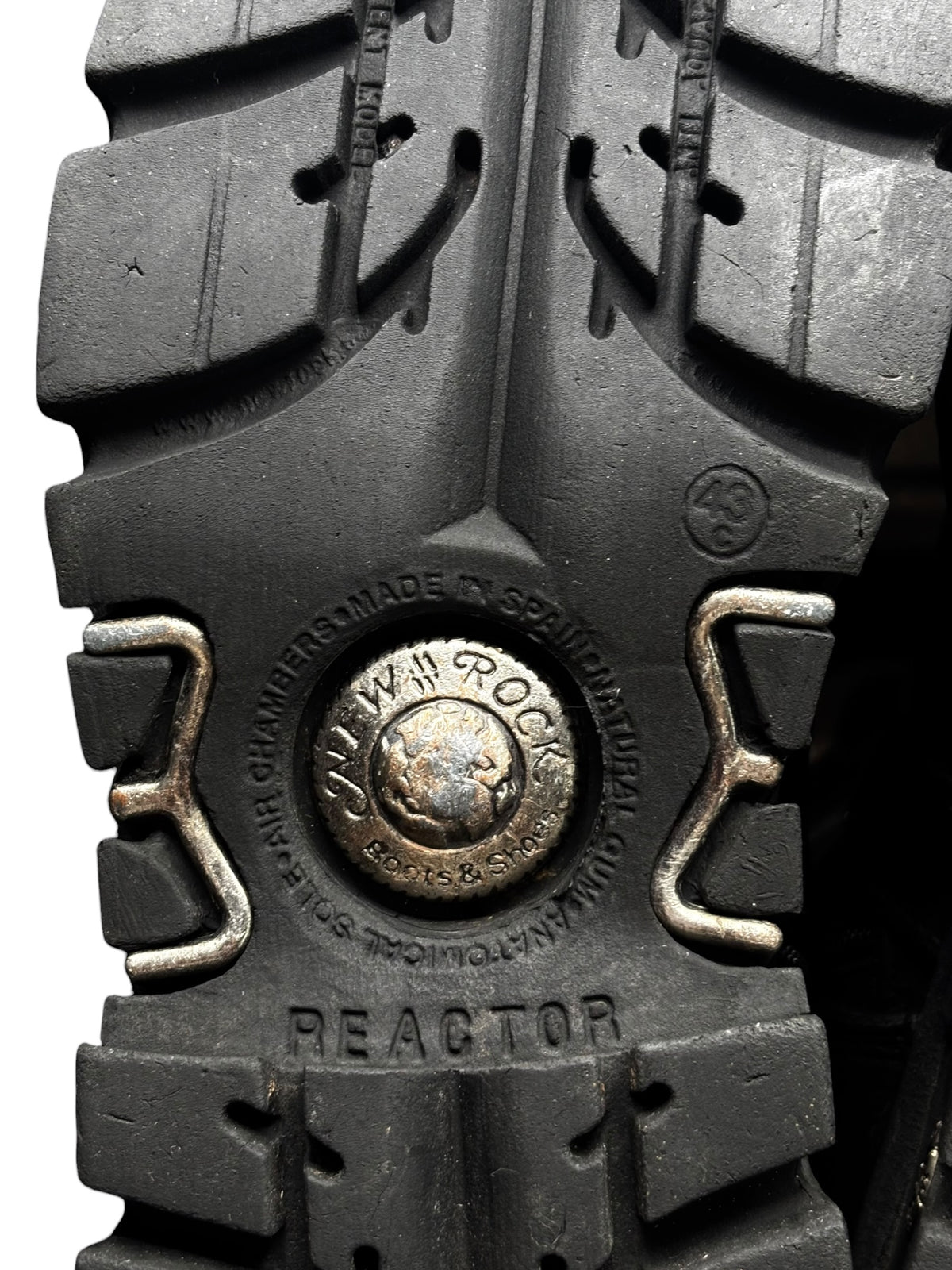 Reactor boot outsole close-up with embossed text and metal guard hardware