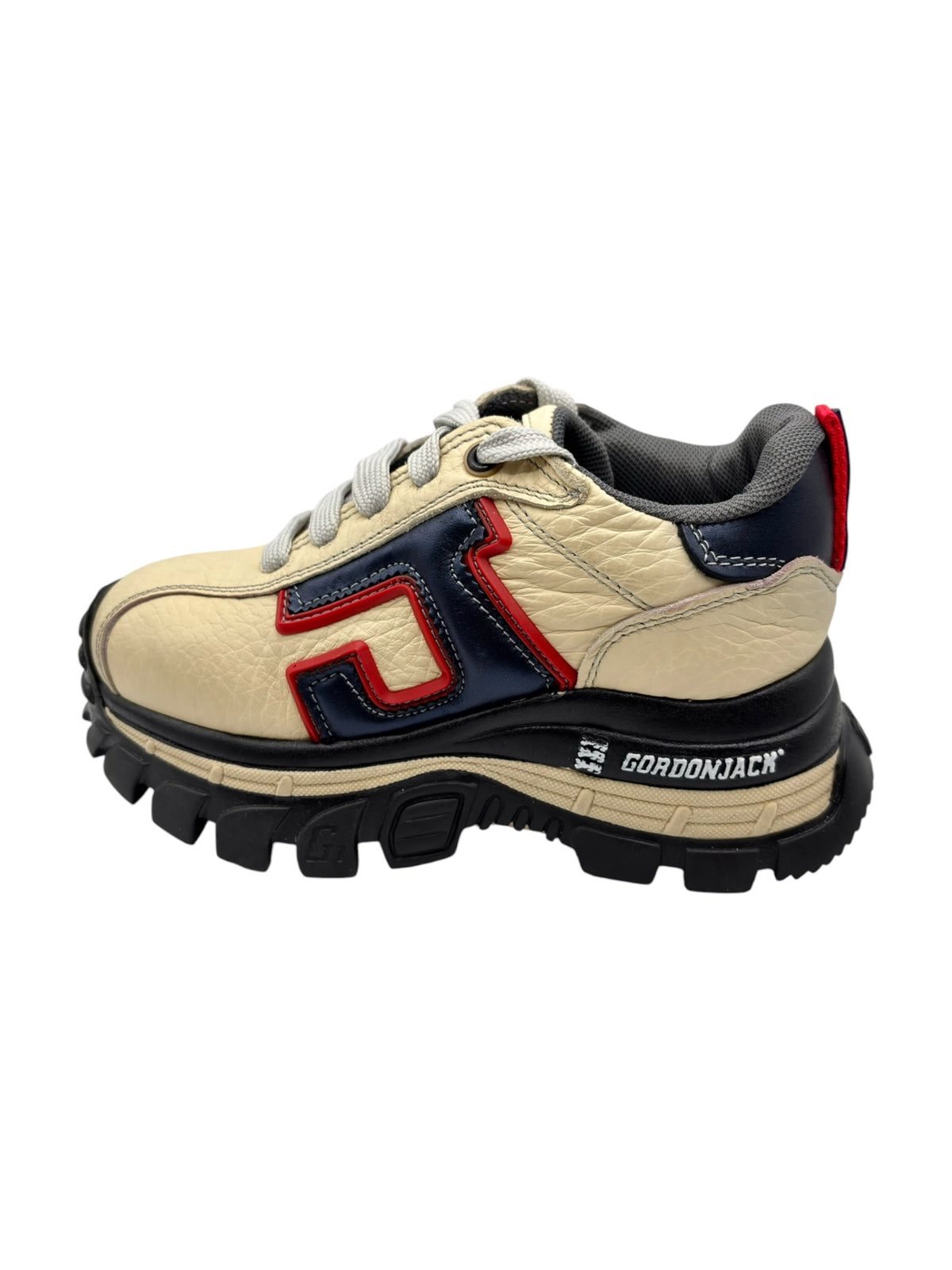 Beige platform sneakers with red and navy side panel accents