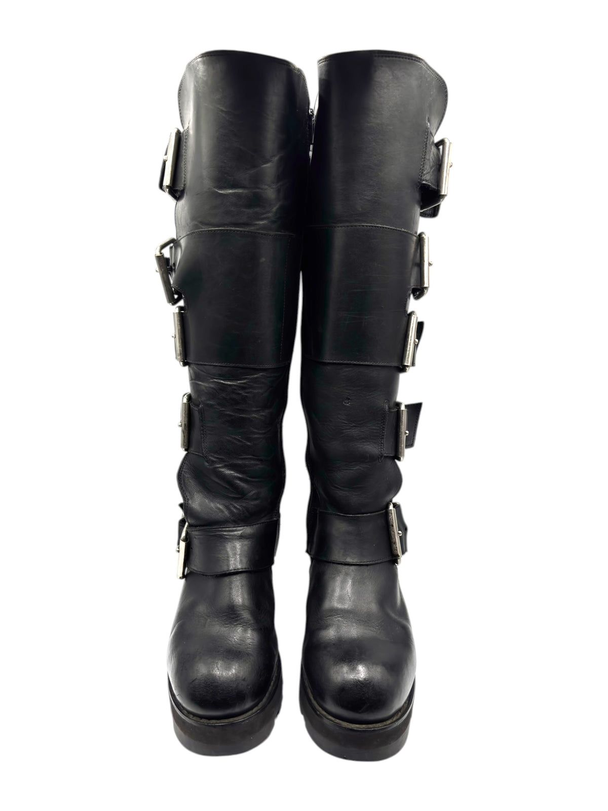 Black knee-high vintage boots with multiple buckled straps and chunky sole