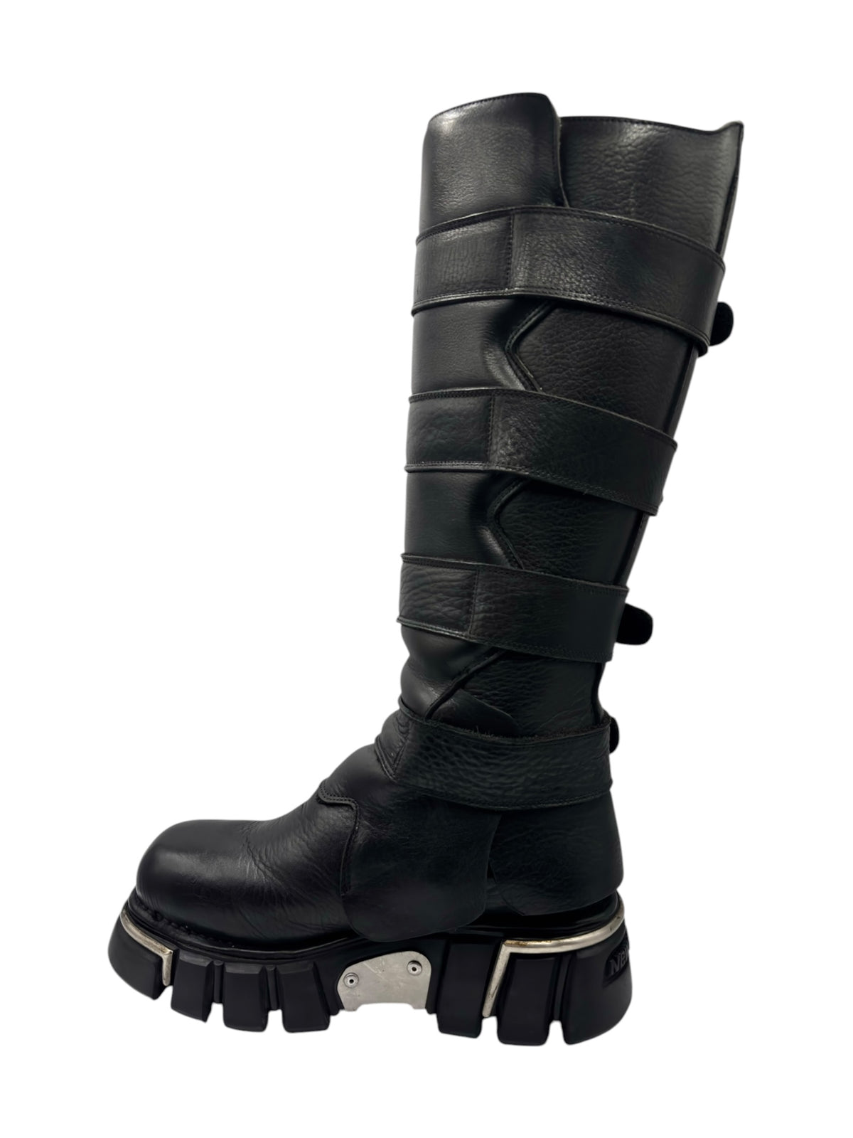 Black knee-high boots with layered straps, metal buckles, and thick tread soles