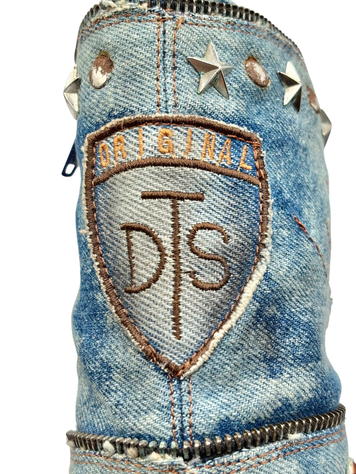 Mid-calf denim boots side with star studs and stitched “ORIGINAL DS” crest patch