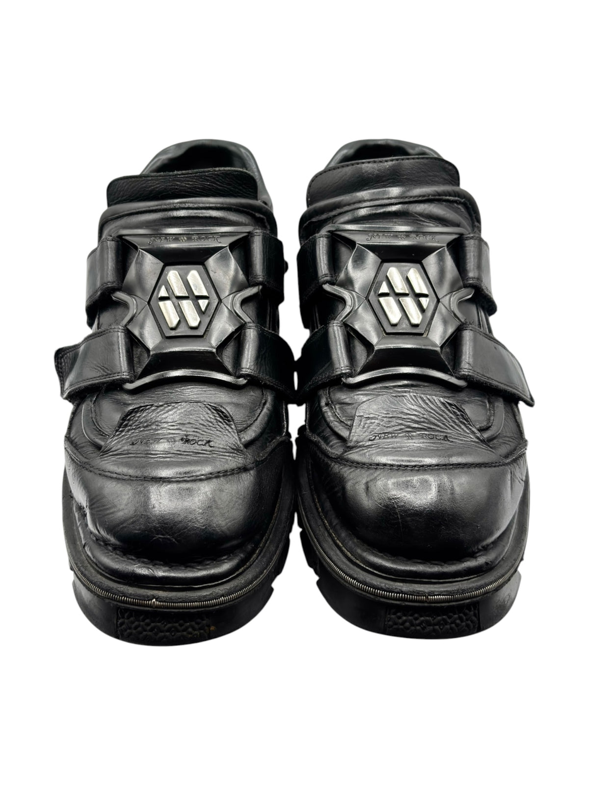 Black leather platform boots with double straps and square metal buckles