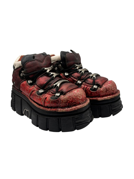 New Rock red platform boots with black lug soles, eyelets, and patterned upper leather