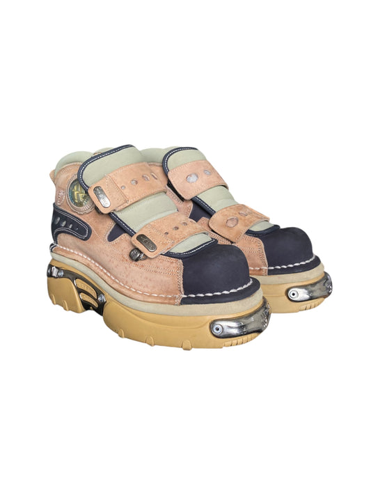 Beige and navy platform boots with double buckle straps, stitched seams, chunky sole