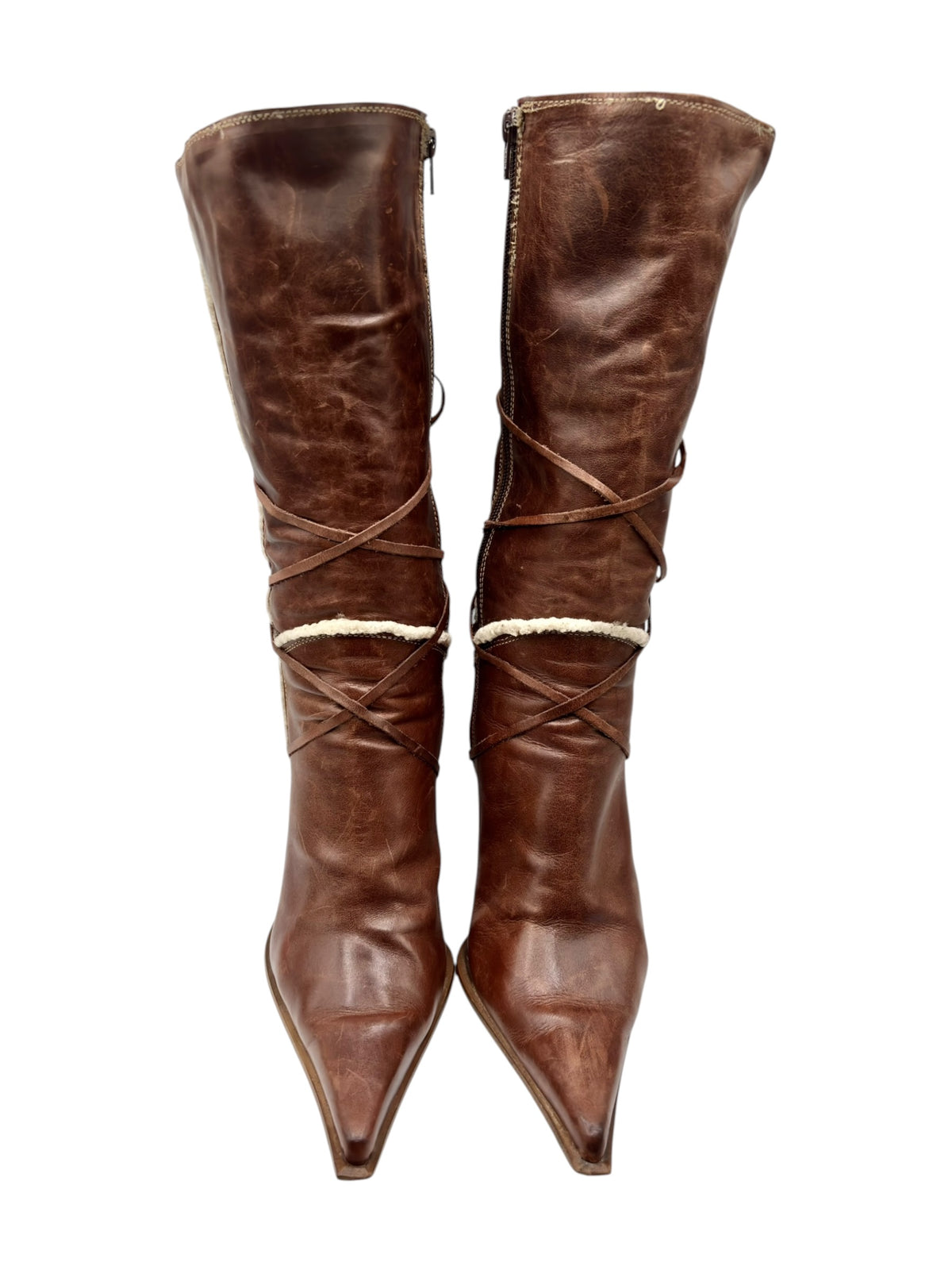 Brown leather pointy-toe mid-calf boots with crisscross lace-up straps