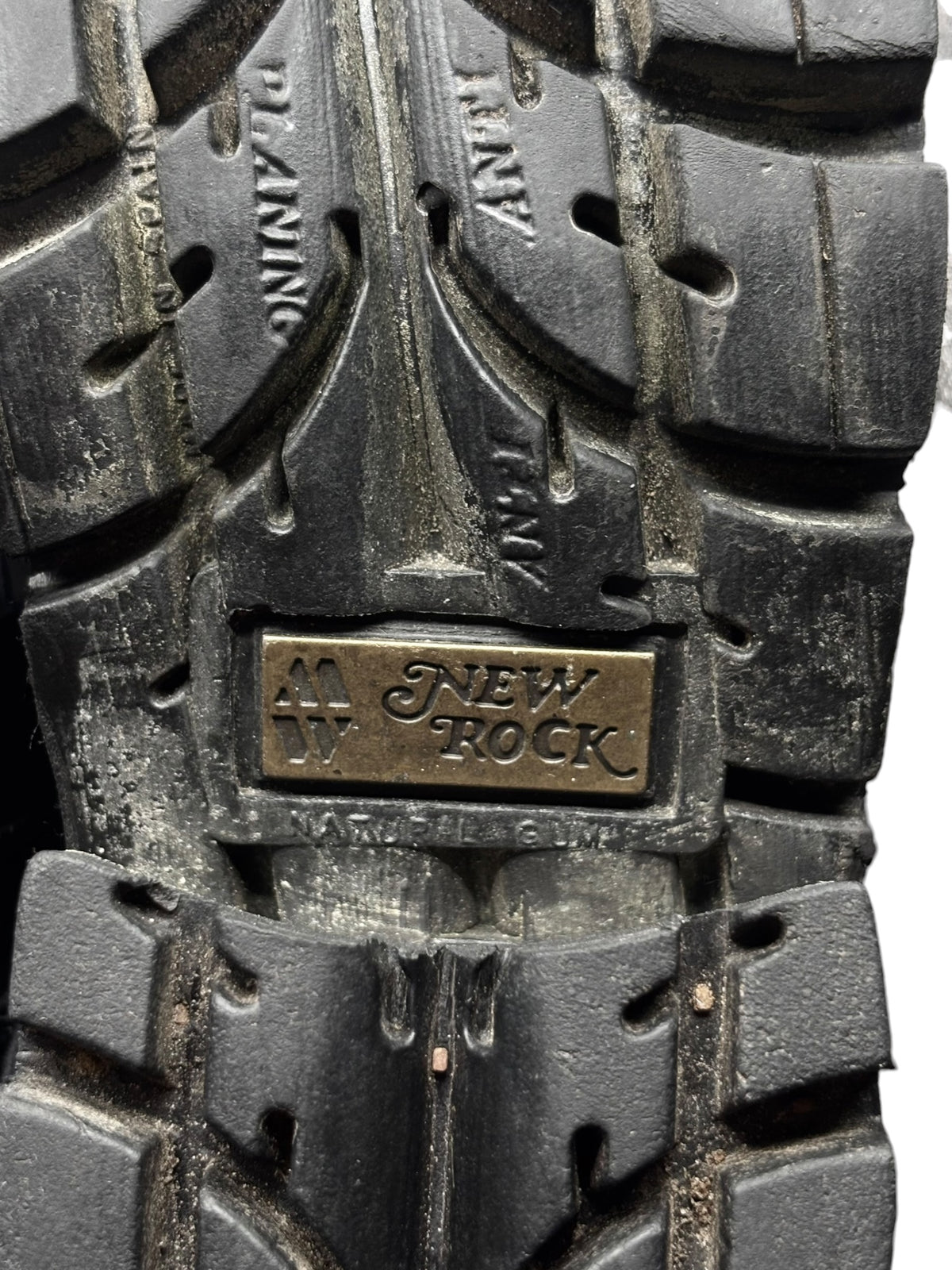 Vintage New Rock boot outsole with block tread and embossed brand plate