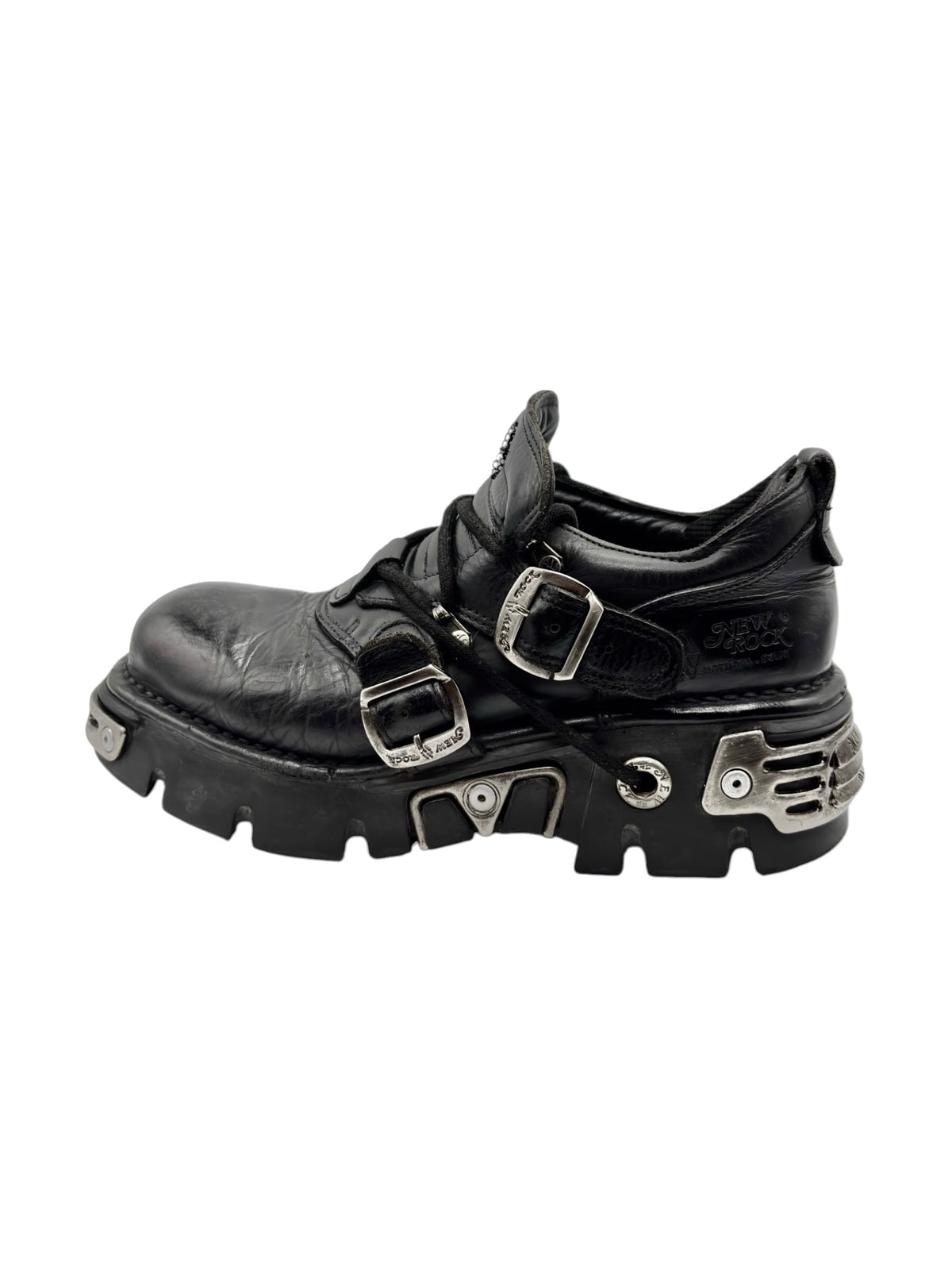 Black ankle platform boots with two front buckles and thick rubber tread sole.