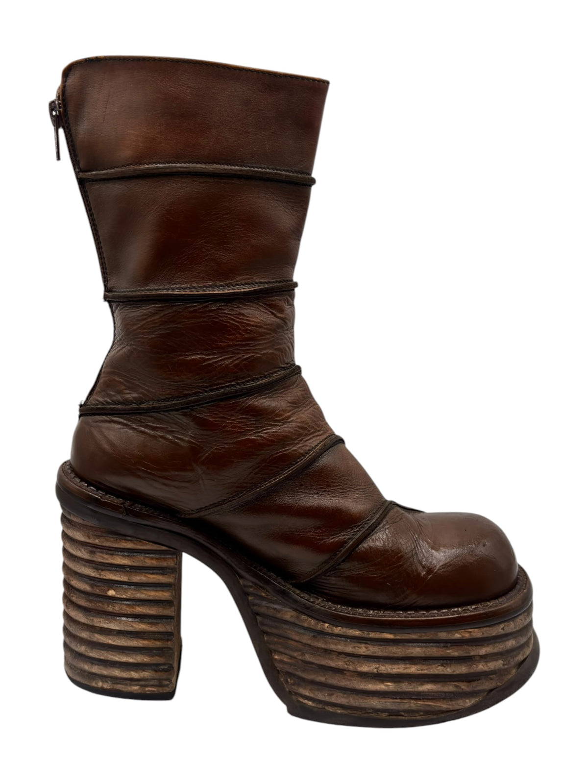 Side view of brown mid-calf platform boots with stacked block heel and zipper tab.
