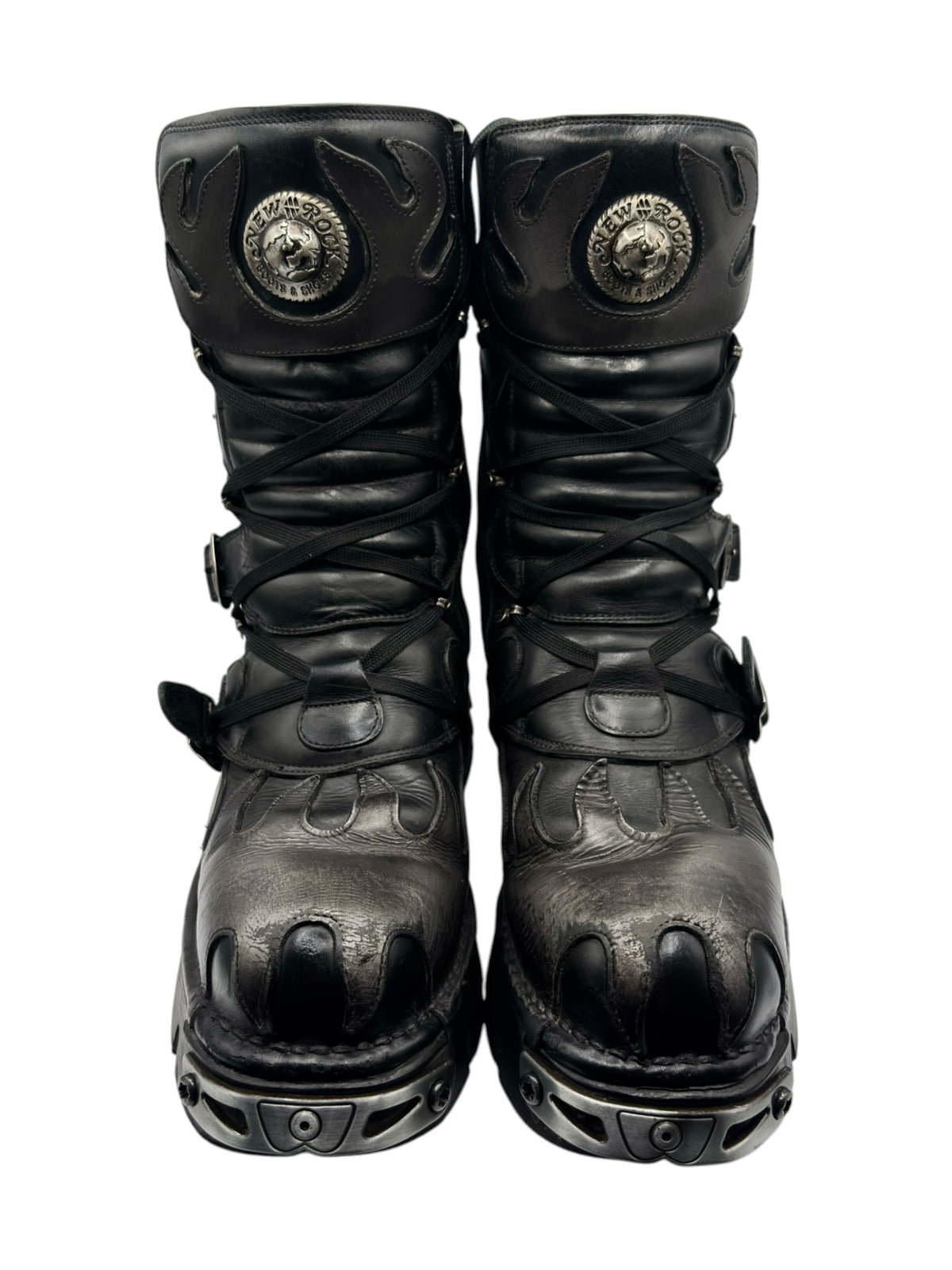 Vintage lace-up flame reactor boots with round emblem, buckles, and chunky platform sole