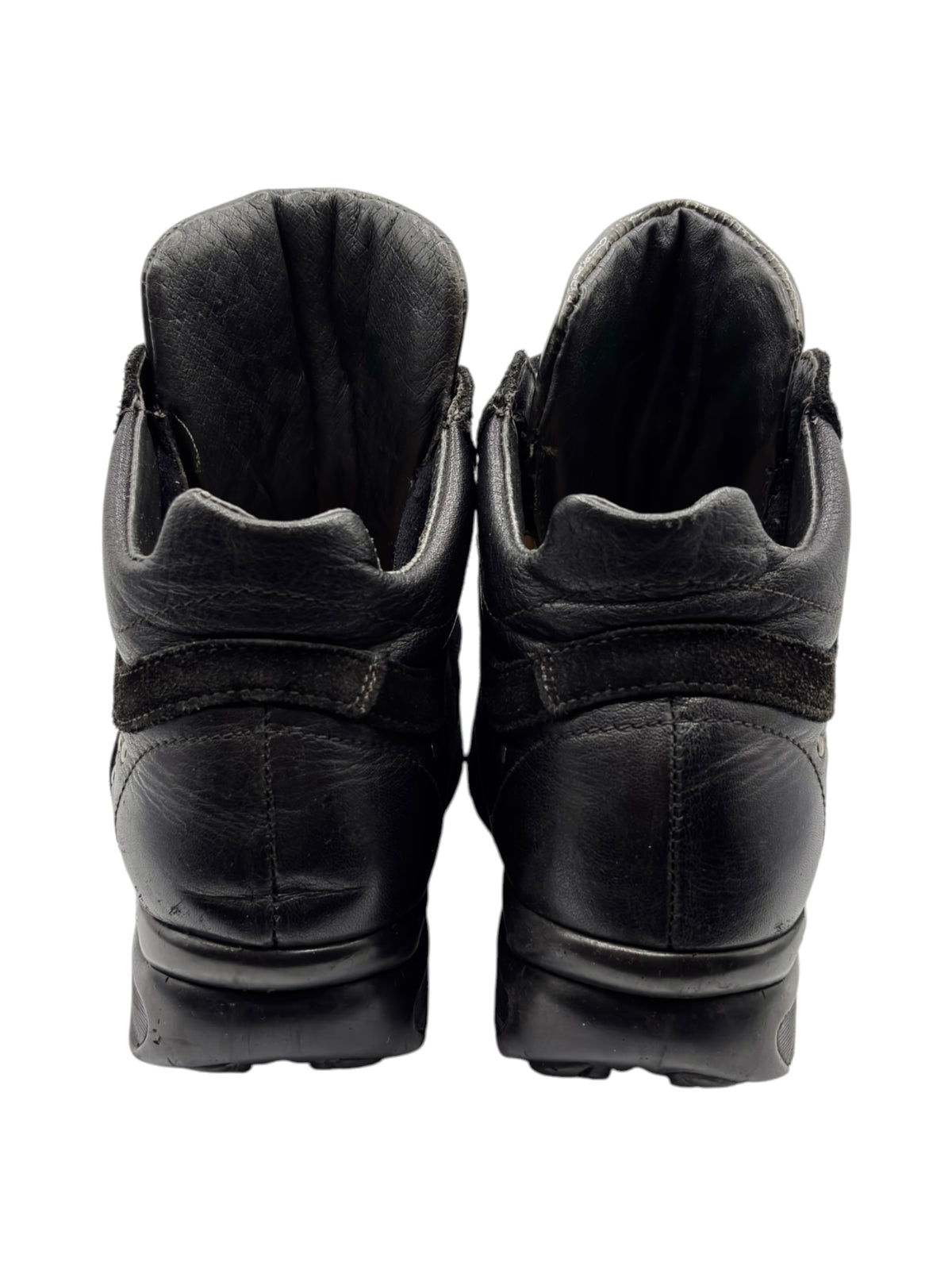 Back view of black leather sneakers showing padded heel collars