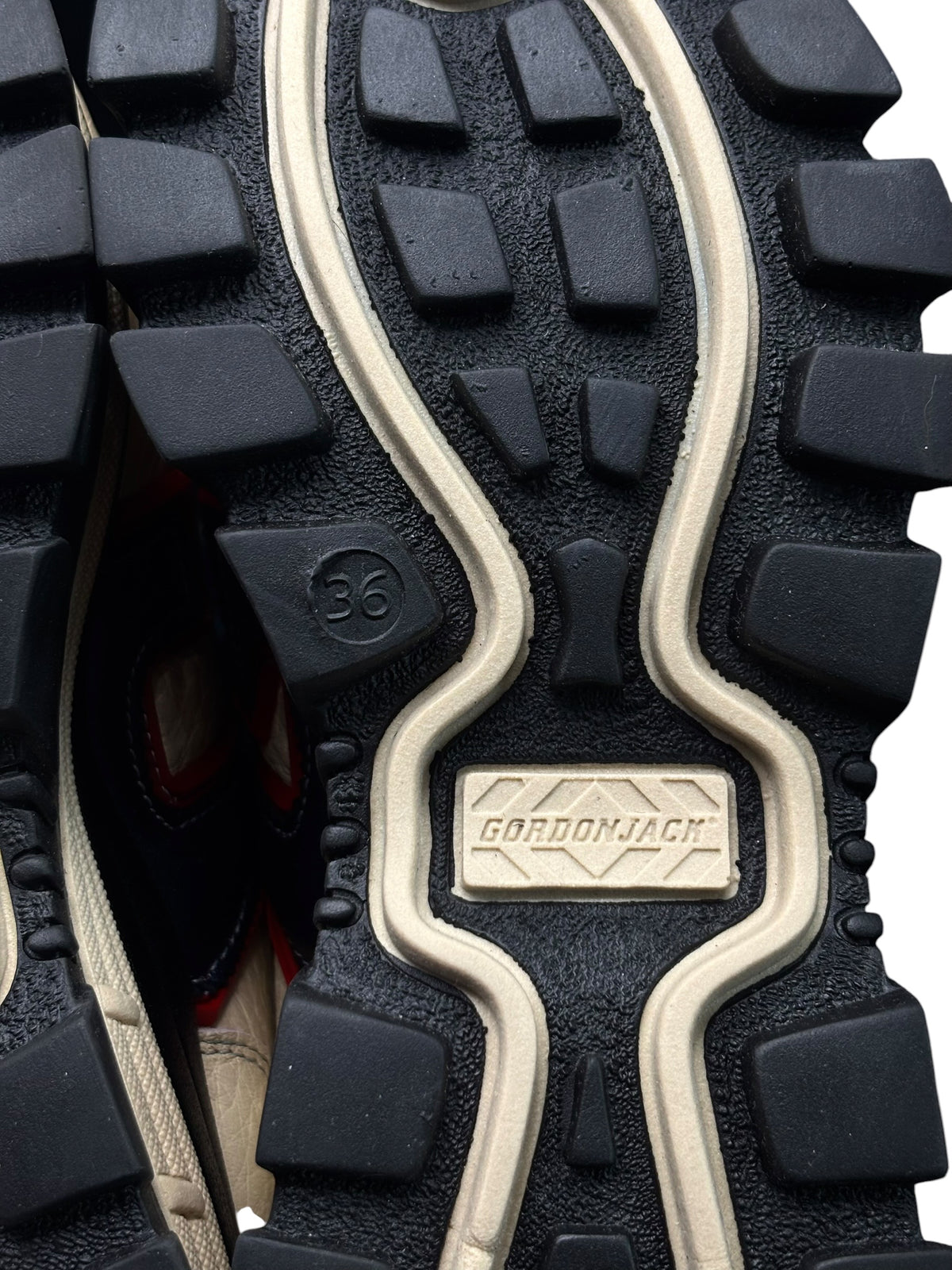 Black rugged outsole with cream trim and Gordon Jack logo plate