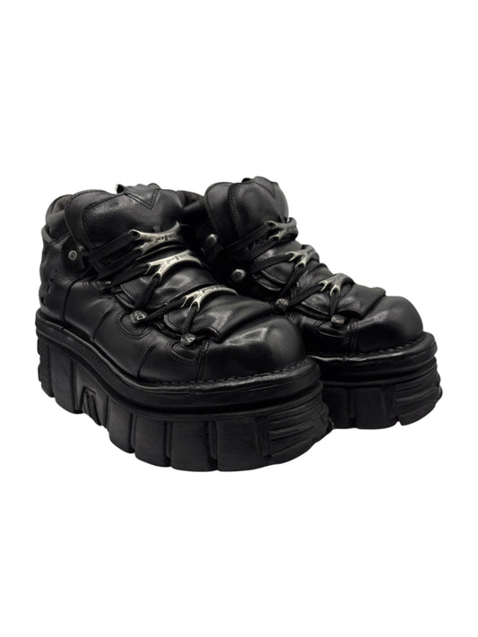 Black platform boots side view with thick lugged sole