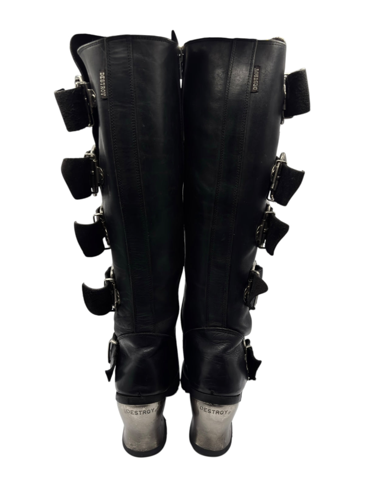 Pair of black knee-high boots with multiple side buckle straps and tall zipper seams