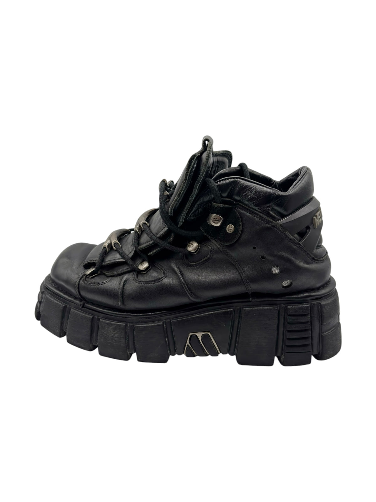 Black platform boots with chunky ridged sole, lace-up front, and metal eyelets