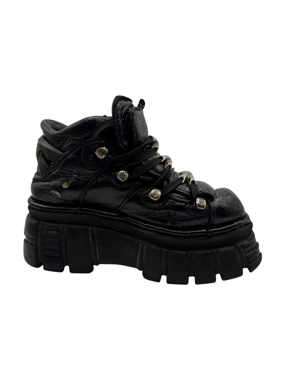 Black lace-up platform boots with raised tread sole and decorative stitching