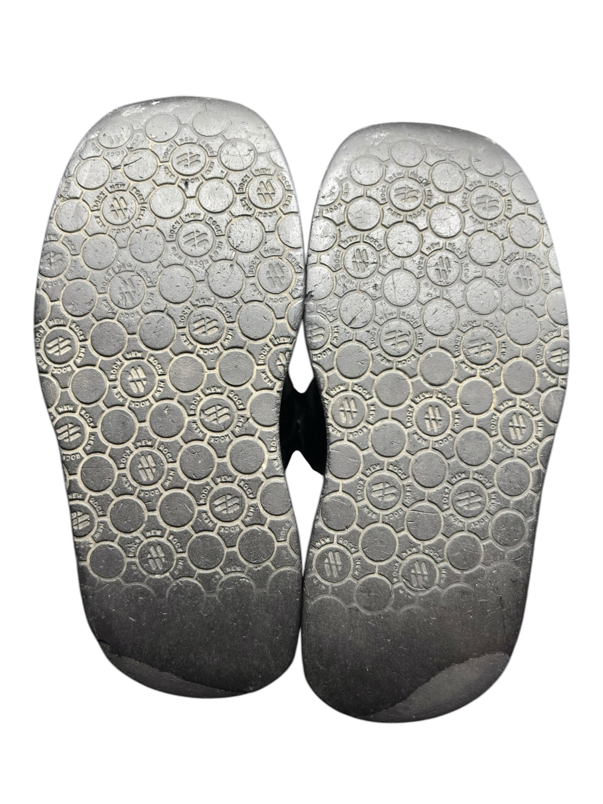 Pair of outsoles with circular traction pattern and thick platform base