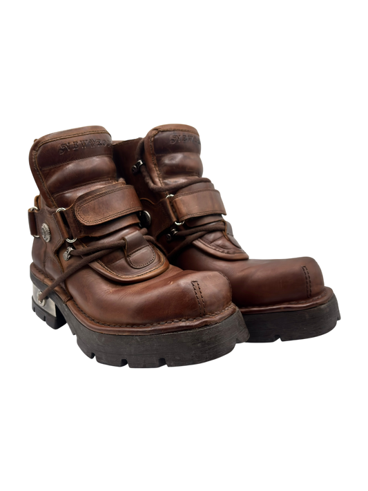 Brown leather ankle boots, side view with lace-up straps and raised platform sole