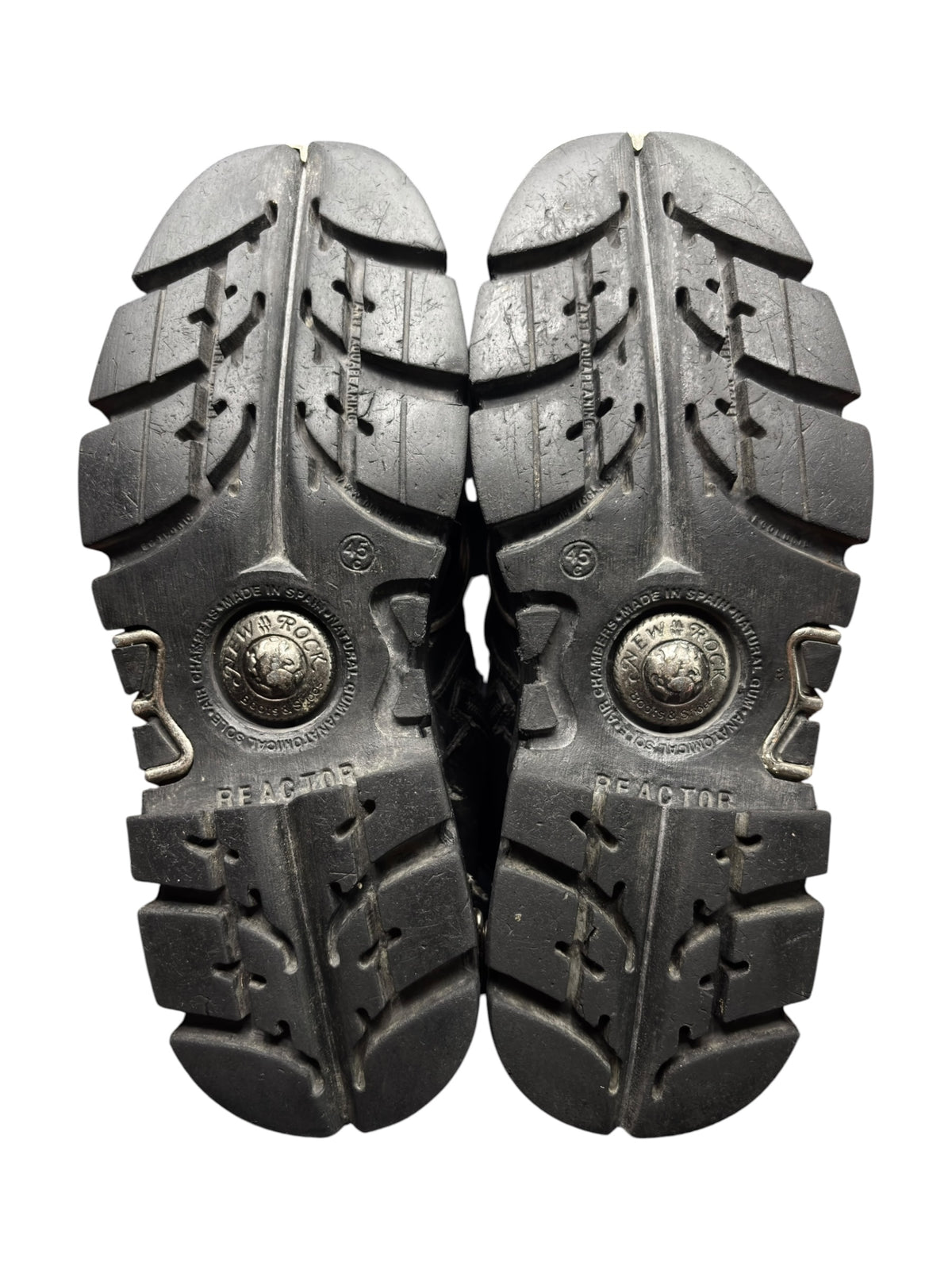 Pair of New Rock reactor boots black lug soles with deep tread pattern